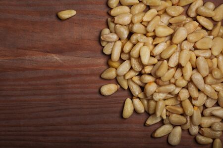 Pine nuts over wooden background.の写真素材