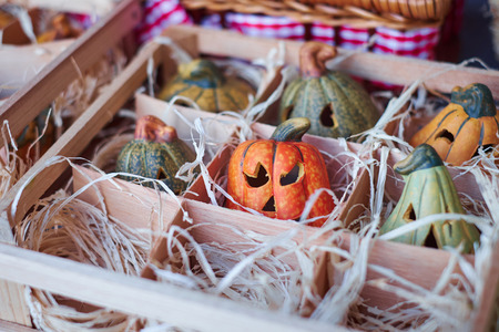 Many pumpkins on the wooden box.の写真素材
