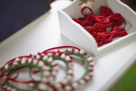 Red bow ties in a white box.の写真素材