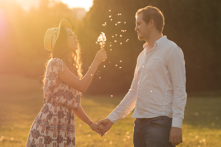 Loving and happy couple at sunset.の写真素材