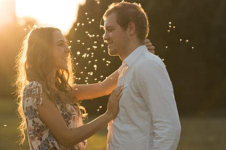 Loving and happy couple at sunset.