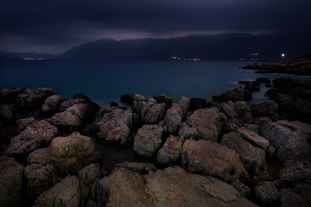 stones water mountains light sky night silenceの写真素材