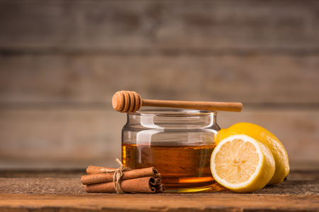 honey mint and lemon on a wooden backgroundの写真素材