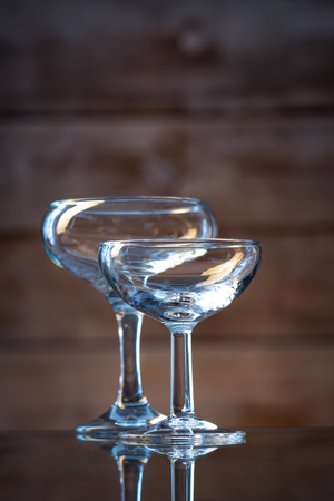 glasses of different shapes on a wooden backgroundの写真素材