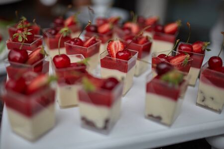 the wedding table is decorated with various beautiful desserts