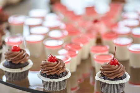 the wedding table is decorated with many beautiful desserts