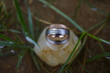 wedding gold rings for newlyweds on a stone, rings for a weddingの写真素材