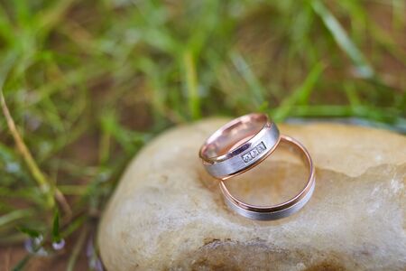 wedding gold rings for newlyweds on a stone, rings for a weddingの写真素材