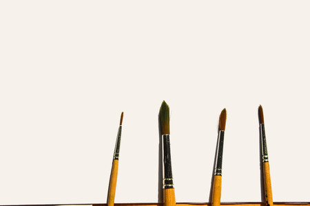 paint brushes on white paperの写真素材