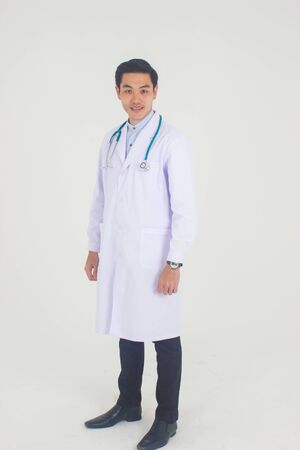 Portrait of young male doctor isolated on white backgroundの写真素材