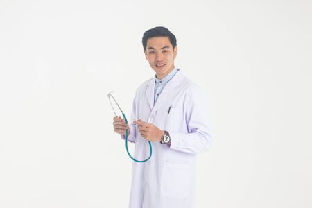 Male doctor with stethoscope in hands isolated on white backgroundの写真素材