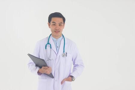 Asian young doctor with folder isolated on white backgroundの写真素材