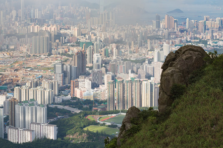 Hazy Hong Kong city skyline,an aerial view from Kowloon peakの写真素材