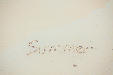 Handwritten Word Summer On Sand Of Beach with vintage style,background and texture