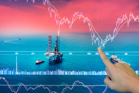 Stock market concept with oil rig in the gulf and oil refinery industry background,Double exposureの写真素材