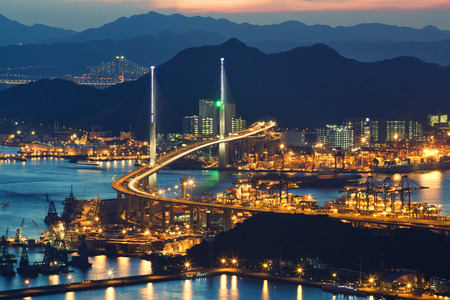 container ship in import export and business logistic with beautiful bridge over the seaのeditorial素材