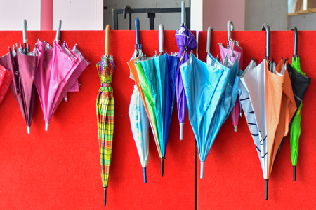 Umbrellas Hanging on Wallの写真素材