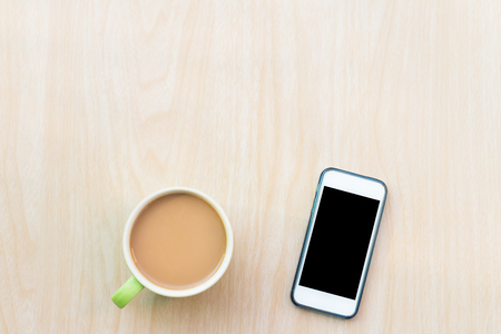 Coffee and smart phone. Breakfast in the morning on an copy space and using smart phone. The Creative modern Business top viewの写真素材