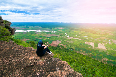 Young woman traveler Arrive at the top of the mountain. Is the destination of travelの写真素材