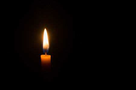 Candlelight on black background at nightの写真素材