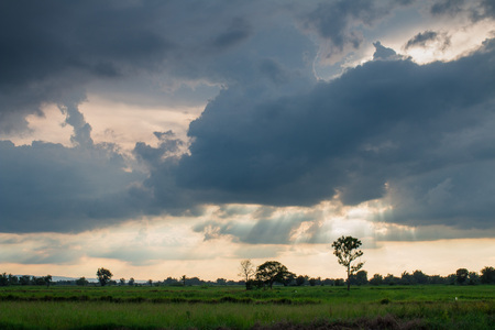 Storm formed Along with the sun through the clouds.dark toneの写真素材