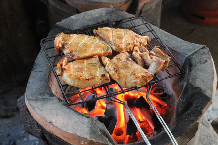 A delicious looking steak cooking on the grill.の写真素材