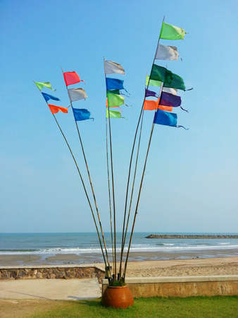 Colourful flag and the beach