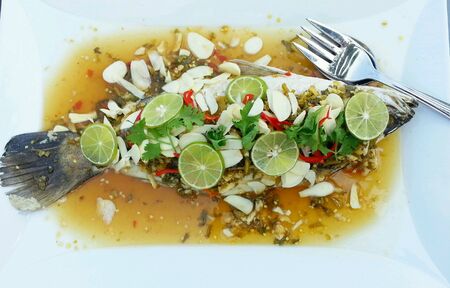 Spicy food ,fish with garlic and lemonの素材