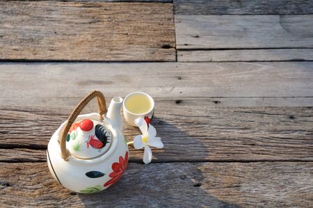Teapot and cups on the table in the morning の写真素材