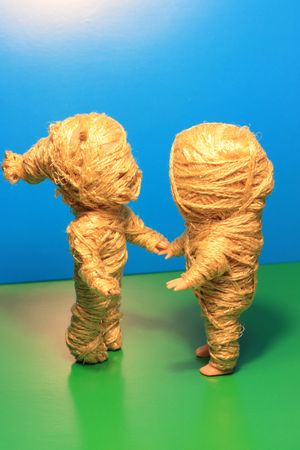 Mummy dolls couple. Shake with ropes.