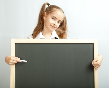 Girl behind clear blackboardの写真素材