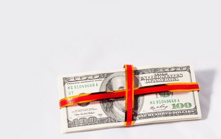 Best gift is money  Red ribbon  Over white background