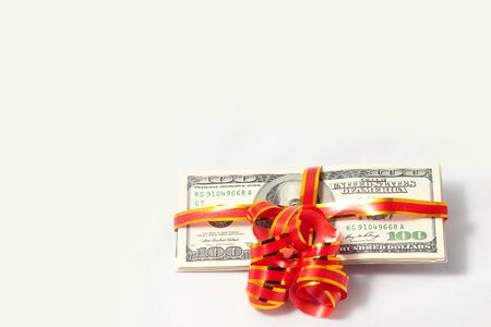 Best gift is money  Red ribbon  Over white backgroundの写真素材