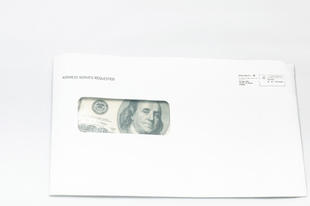 Money in the paper envelope  Over white