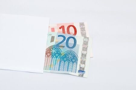 Money in the paper package  Over white