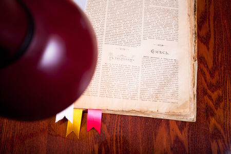 Lamp over old book on the table.の写真素材