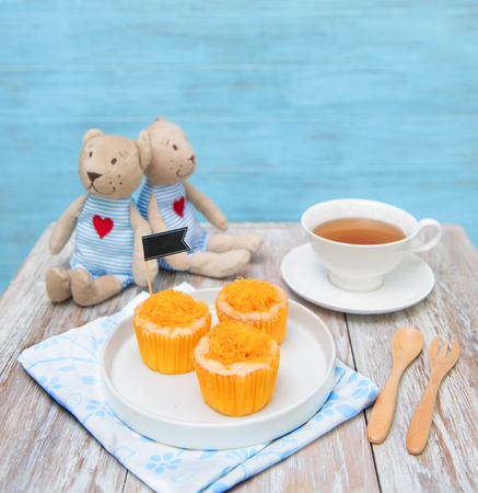 Tasty cups cake  with tea on table decrorateの写真素材