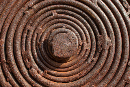 Brown, black and yellow rust and stains on the coiled steel. Brown abstract texture and corroded metal background. Rust corrosion.の写真素材