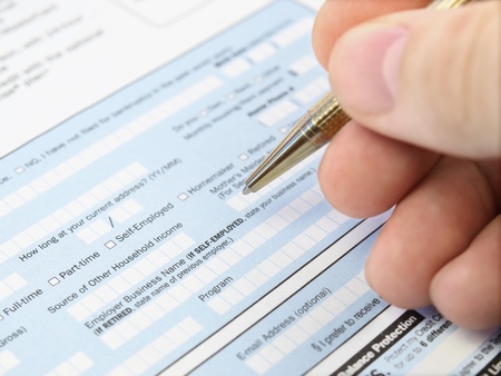 Man filling out  application formの写真素材