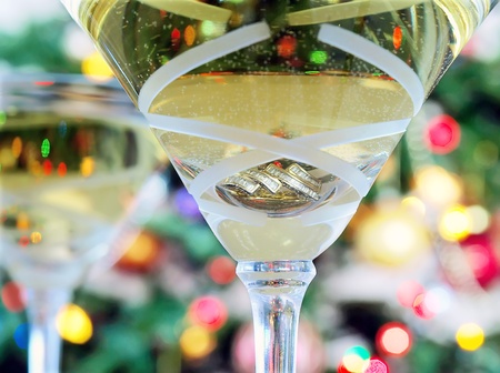 Close-up of martini glasses with christmas gift の写真素材