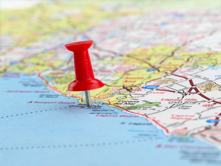 Clouseup of red pushpin on the map Clouseup of red pushpin on the map