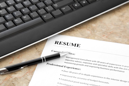 Resume with Pen and Keyboard on the Table 