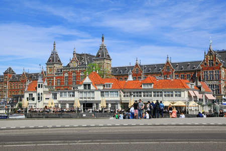 AMSTERDAM - MAY 13, 2016: Centraal Train Station is major national railway hub and used by 260,000 passengers a dayのeditorial素材