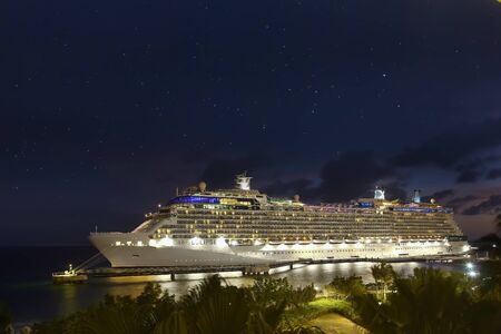 WILLEMSTAD, CURACAO - APRIL 10, 2018:  Cruise ship Celebrity Eclipse docked at night in port Willemstad. The island is a popular Caribbean cruise destinationのeditorial素材