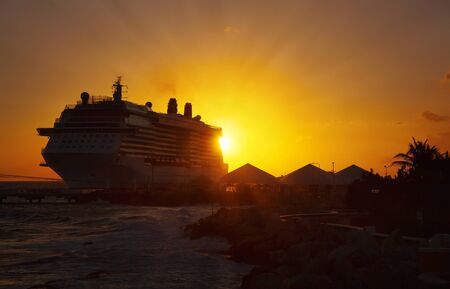 Cruise ships docked at tropical port on sunset.の写真素材