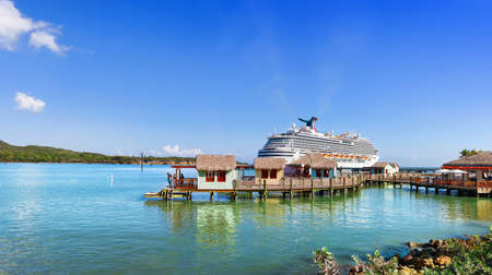 AMBER COVE, PUERTO PLATA, DOMINICAN REPUBLIC - MARCH 26, 2019: Cruise ship Carnival Magic docked at port Amber Cove on sunny dayのeditorial素材