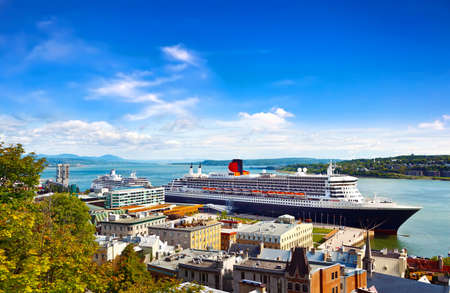 QUEBEC CITY, CANADA - SEPTEMBER 09, 2019: RMS Queen Mary 2 is the largest ocean liner ever built, having served as the flagship of the Cunard Line docked at port Quebec Cityのeditorial素材