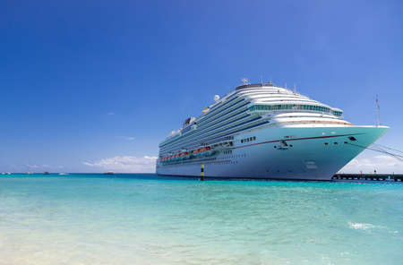Luxury cruise ship in port on sunny dayの写真素材