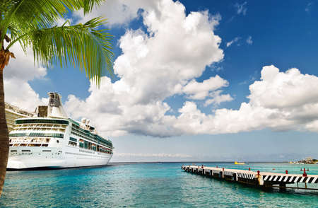 Cruise ship docked at port on sunny dayの写真素材