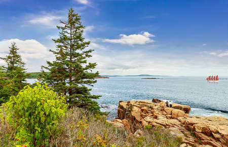 Panoramic view of Bar Harbor with rocky coast  and sail boat on sunny dayの写真素材